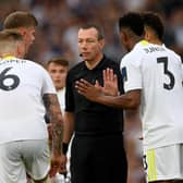Leeds United players contest Kevin Friend's ruling at Elland Road, where the Whites fell to a 2-1 defeat to West Ham United. Pic: Stu Forster