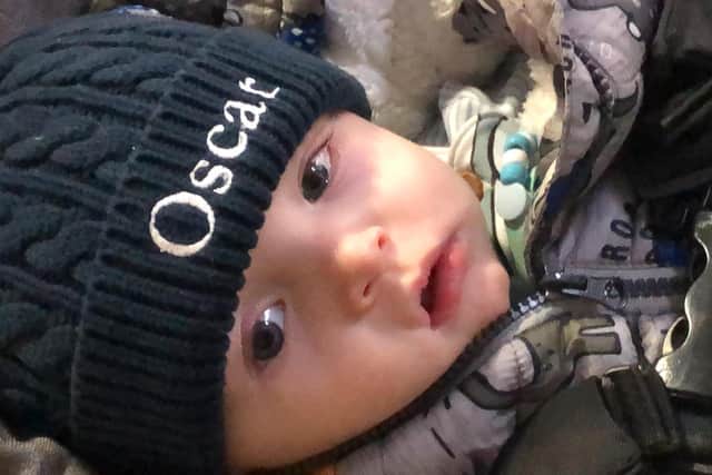 Lucy Battle, 20, was trying to give away her her old two seater couch when she accidentally included a picture of her seven-month-old son Oscar