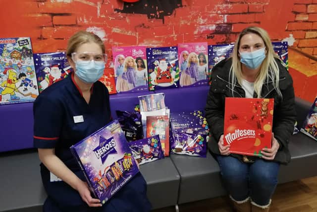 Clare Chapman (right) pictured with some of the donated advent calendars and a member of nursing staff at Leeds Children's Hospital