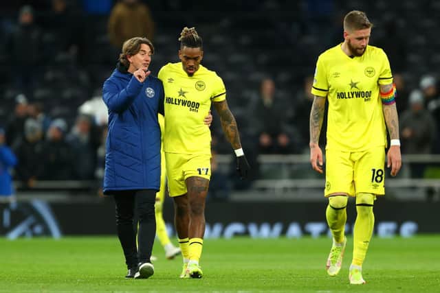 CHIEF THREAT: Brentford striker Ivan Toney, centre, pictured next to Bees boss Thomas Frank, left, and captain Pontus Jansson, right, after Thursday night's 2-0 defeat at Tottenham. Photo by Clive Rose/Getty Images.