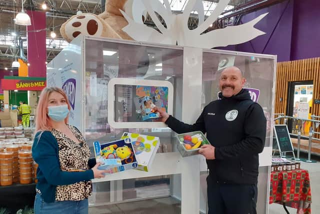 Malcolm Michaels in Kirkgate Market is once again asking people to donate presents for the children of those being supported for alcohol and drug use by Forward Leeds. From left to right Sarah Hindle from Forward Leeds and butcher Malcolm Leary.