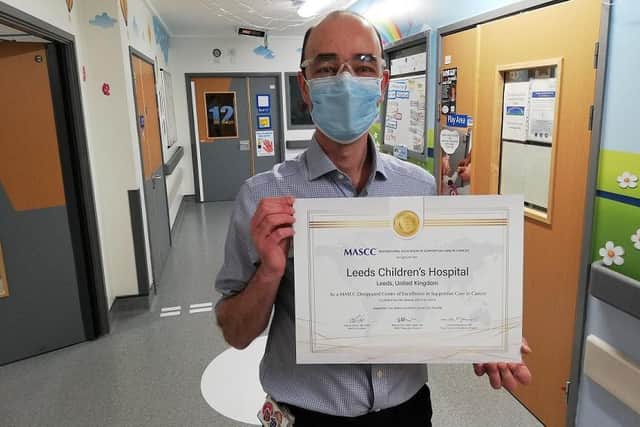 Consultant oncologist Dr Bob Phillips with the certificate