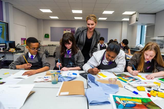 Interpretations of Picasso in an art lesson at Trinity Academy Leeds, watched over by principal Kat Cafferky.