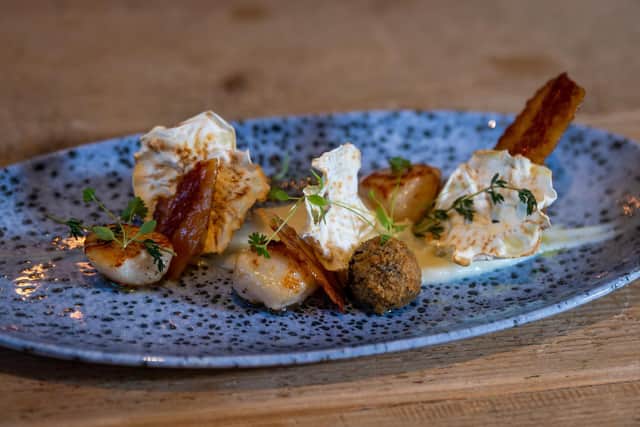 Seared Scottish king scallops served with roast celeriac puree, black pudding bon bons, crispy Parma ham and celeriac crisps