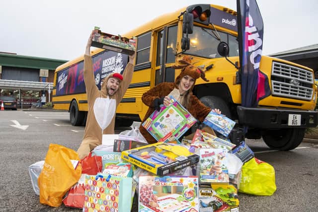 Pulse 1 radio breakfast show presenters Danny Mylo and Rosie Madison have taken the toy appeal on the road in an American yelllow school bus.

Photo: Tony Johnson