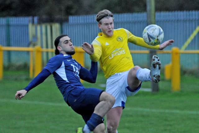 Majed Alasttal, of Whitkirk Wanderers, goes toe to toe with Horsforth's Joe Tasker during Saturday's West Riding County FA Cup encounter that went Saints' way 3-2. Picture: Steve Riding.