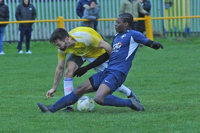 Horsforth SM's Loz Power tangles with Ayrton Stewart-Savery of Whitkirk Wanderers during Saturday's West Riding County FA Cup clash. Picture: Steve Riding.