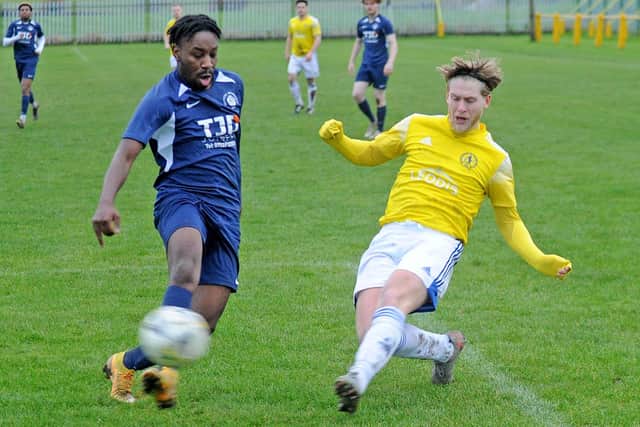 Joe Tasker, of Horsforth St Margarets, takes on Kadeem Morton, of Whitkirk Wanderers during Saturday's West Riding County FA Cup clash. Picture: Steve Riding.