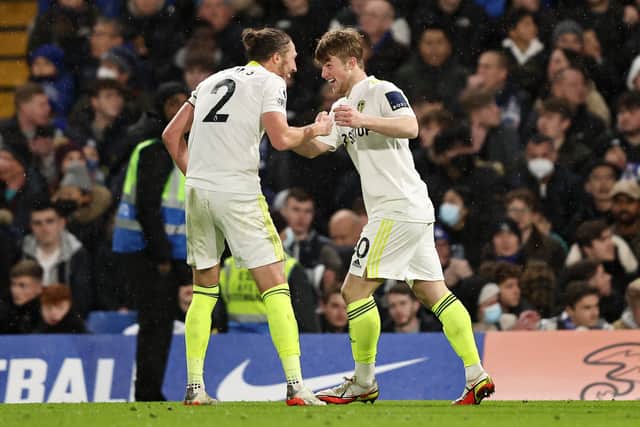 Joe Gelhardt celebrates with Luke Ayling after scoring against Chelsea. Picture: Marc Atkins/Getty Images.