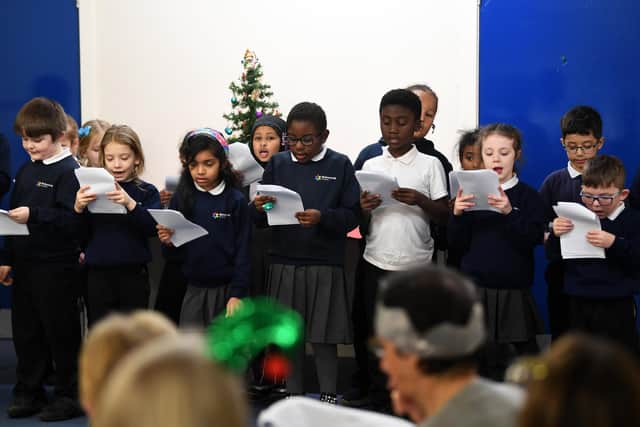 Pupils from Richmond Hill Academy sing carols at York Road Primary Care Network's Christmas lunch. Picture: Jonathan Gawthorpe