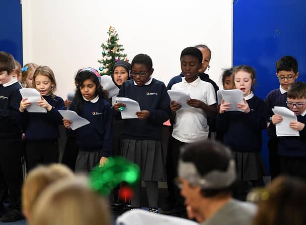 Pupils from Richmond Hill Academy sing carols at York Road Primary Care Network's Christmas lunch. Picture: Jonathan Gawthorpe