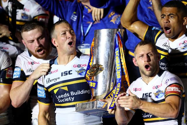 Danny McGuire and Rob Burrow of Leeds Rhinos celebrate with the trophy and their team-mates at the end of the Betfred Super League Grand Final match between Castleford Tigers and Leeds Rhinos at Old Trafford on October 7, 2017 in Manchester, England. (Picture: Michael Steele/Getty Images)
