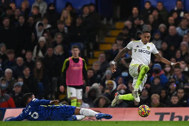 CLASS ACT: Leeds United star Raphinha, right, skips away from Chelsea's Thiago Silva in Saturday's Premier League clash at Stamford Bridge. Photo by GLYN KIRK/AFP via Getty Images.