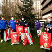 Leeds Rhinos players' Jack Broadbent, Rhyse Martin and Bodene Thompson deliver Christmas presents to Helen McDonald (Events Fundraising Officer) and Lisa Beaumont (Therapeutic and Specialised Play Manager) from Leeds Children's Hospital. (SIMON HULME)