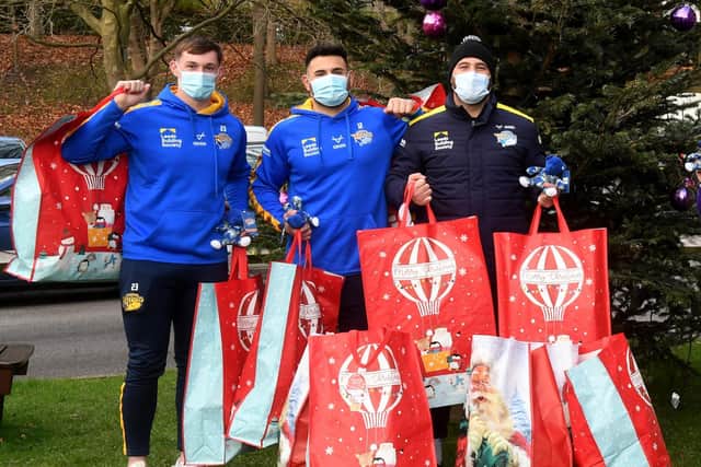 Leeds Rhinos players' Jack Broadbent, Rhyse Martin and Bodene Thompson deliver Christmas presents to Leeds Children's Hospital (SIMON HULME)