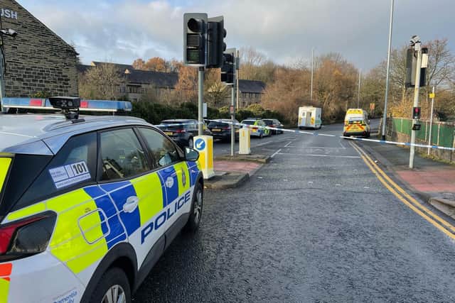 Police at the scene in Leeds and Bradford Road following the fatal collision.