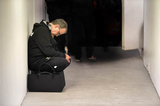 CRUSHED MAN - Marcelo Bielsa was pictured in February 2019 looking dejected after a Leeds United defeat at QPR but he and the Whites came roaring back and must do the same after Tuesday's Manchester City loss. Pic: Bruce Rollinson