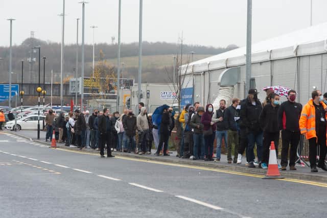 Long queues at the Leeds Covid Vaccination Centre on Bobby Collins Way next to Elland Road on Monday December 13. PIC: James Hardisty