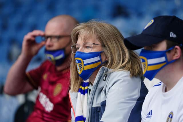 Leeds United fans wearing masks in the stands at Elland Road. Pic: Jon Super.