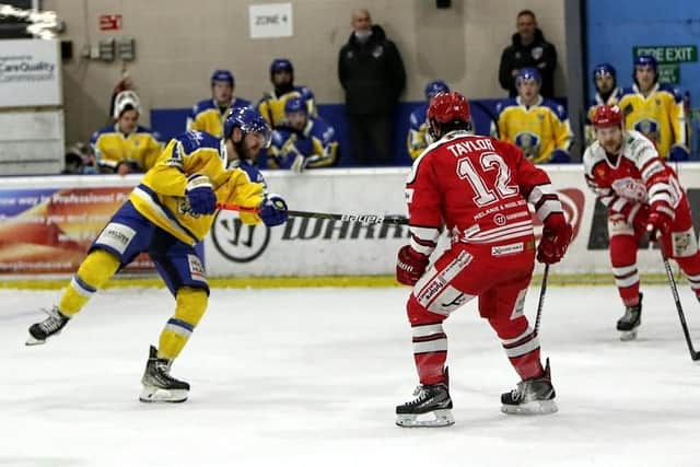 INCOMING: Leeds Knights' Adam Barnes, left, gets in a shot on Swindon Wildcats' net in the second period. Picture courtesy of David North/Swindon Wildcats.