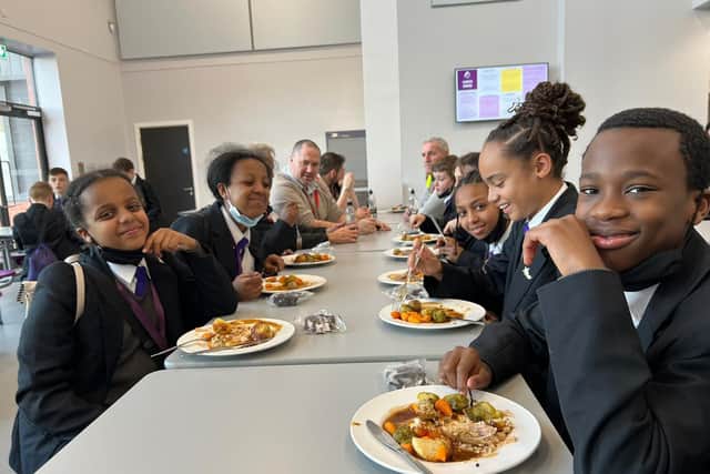 11-year-old Harleigh Lewis, second from right, and other pupils at Trinity Academy Leeds enjoy a Christmas meal paid for by kind-hearted contractors (Photo: TAL)