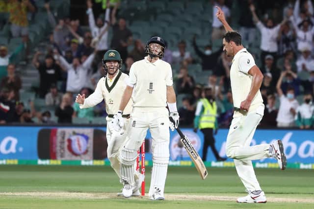 Gone: England's Joe Root is dismissed by Australia's Mitchell Starc.