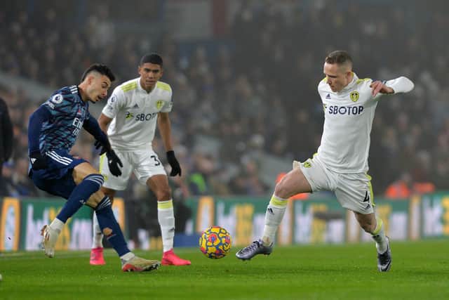 TOUGH NIGHT: For Leeds United and midfielder Adam Forshaw, right, in Saturday evening's Premier League clash against Arsenal at Elland Road. Picture by Bruce Rollinson.