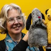 Curator of Leeds History, Kitty Ross, with Sooty and Sweep toys on display at Abbey House Museum (Photo: Tony Johnson)