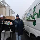 LUFC Supporters Trust foodbank collection before the Leeds United v Arsenal game. Pictured are Gib Aslam, Amie Thompson and Wendy Doyle. Photo: Bruce Rollinson