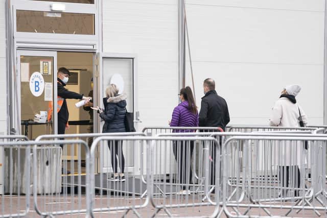 People queueing up to get their jabs at the mass vaccination centre at Elland Road in Leeds yesterday. Picture: Danny Lawson/PA