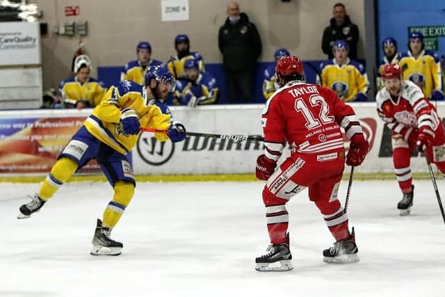 Adam Barnes, left, fires off a shot during Friday night's first leg against Swindon Wildcats in the Autumn Cup Final. Picture courtesy of David North/Wildcats Mieda.