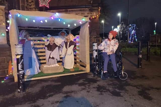 Claire Dobson was thrilled when her carers took her to see the Christmas festivities. She enjoyed the nativity scene outside St Mary's Parish Church.