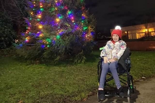 Claire Dobson with the Christmas tree at St Mary's Parish Church.