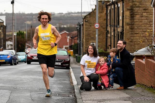 Oliver Harrison is running 100 miles in 24 hours for Cystic Fibrosis Trust. Amelie McIntyre watches on with parents Natasha, Steven and brother Nathaniel. PIcture: Simon Hulme