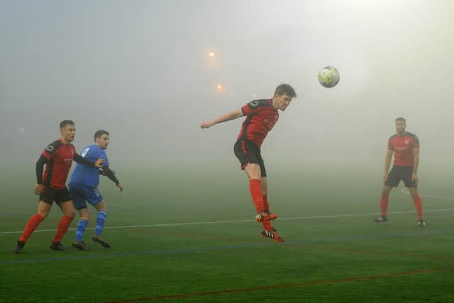 Finlay Ellis heads in the gloom for Horbury Town during the West Yorkshire League Premier Division leaders' 2-1 win at Headingley. Picture: Steve Riding.