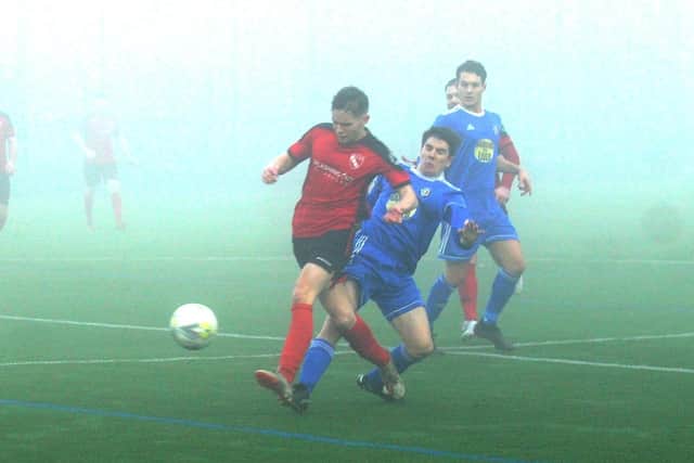 Jay Schofield, of Horbury Town, gets ahead of Headingley's Jamie Bywater during Saturday's West Yorkshire League Premier Division encounter in Leeds. Picture: Steve Riding.
