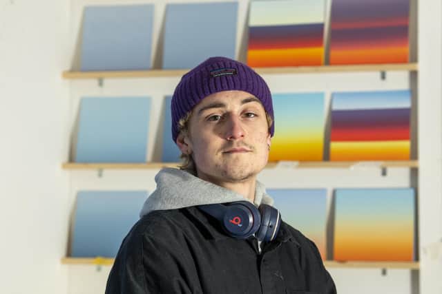 Artist Tom Newhouse from Leeds with some of his paintings of sunrises

Photo: Tony Johnson