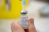 Medical staff and volunteers prepare shots of the Moderna Covid-19 vaccine at a vaccination centre. Curry house customers are being urged to get a booster with their bhaji and a jab with their jalfrezi as a restaurant becomes the latest NHS pop-up coronavirus vaccination site. PIC: Leon Neal/PA Wire