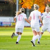 Bridie Hannon celebrates with her Leeds United teammates Kathryn Smith and Rebecca Hunt. Pic: LUFC.