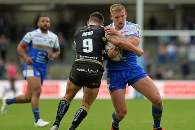 Mikolaj OIledzki takes on Leigh's Liam Hood, who is now at Wakefield and could feature in the Boxing Day game against Leeds. Picture by Jonathan Gawthorpe.