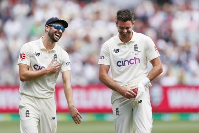 Got him: England's Mark Wood and James Anderson react after the wicket of  Australia's Marcus Harris.