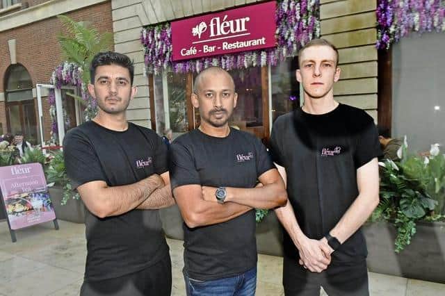 Fleur Cafe will be giving free meals to those in need on New Year's Day. Bobby Geetha with Fleur chefs Zubair, left, and George Smith. Photo: Steve Riding