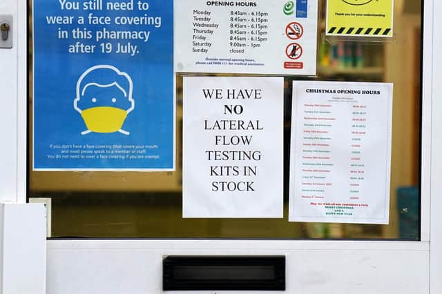 A sign on chemist's door in Dover, Kent, informing customers they have no lateral flow test kits available. (PA)