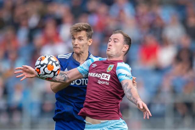 Diego Llorente challenges Ashley Barnes during Leeds United's 1-1 draw with Burnley in August. Pic: Joe Prior.