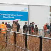 People queue to enter the Leeds Vaccination Centre at Elland Road