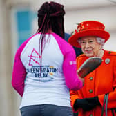 Leeds Paralympian Kadeena Cox has been awarded an MBE in the New Year's Honours List 2022. She is pictured with Queen Elizabeth II at the launch of the Queen's Baton Relay for Birmingham 2022 - the XXII Commonwealth Games (Photo: Victoria Jones/PA Wire)