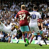 IN THE BEGINNING: Leeds United's Stuart Dallas, back, on his Whites debut back in August 2015 as Uwe Rosler's side face Burnley at Elland Road, the home XI also featuring Chris Wood, centre, and Alex Mowatt, right. Picture by Bruce Rollinson.