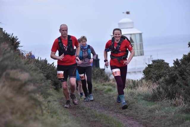 Sarah Norman pictured (front right) taking part in the  gruelling Hardmoors 30 across North York Moors on Saturday January 1.