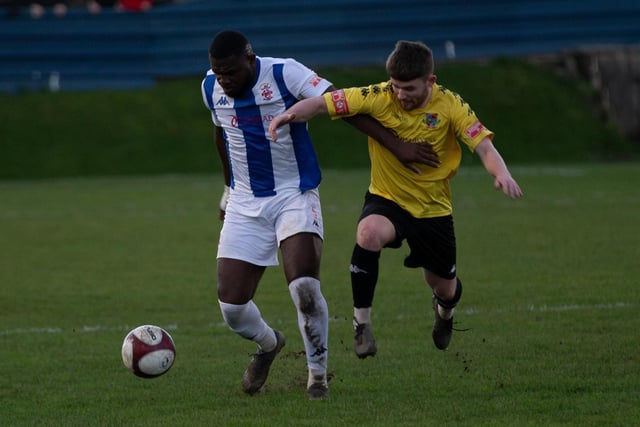 Liversedge's Kevy Tarangadzo keeps possession as he holds off a Pontefract Collieries challenge.