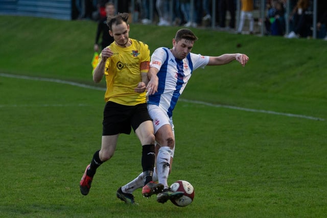 Pontefract Collieries right-back Jack Greenhough challenges Liversedge's Ross Daly.